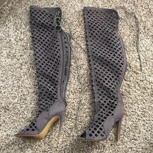 Thigh high heels strapped..